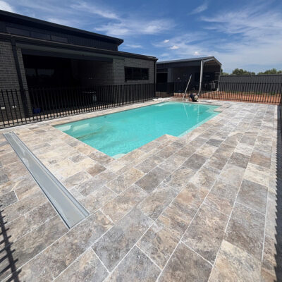 30mm Silver Travertine with drop face Pool Paving | MTK Carpentry Construction.jpeg