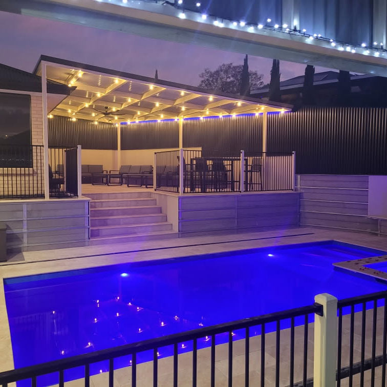 Classic Cream Travertine pool paving and Bookleaf Wall Cladding5